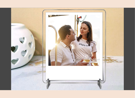 Acrylic polaroid frame with a couple on a stand against a beige background