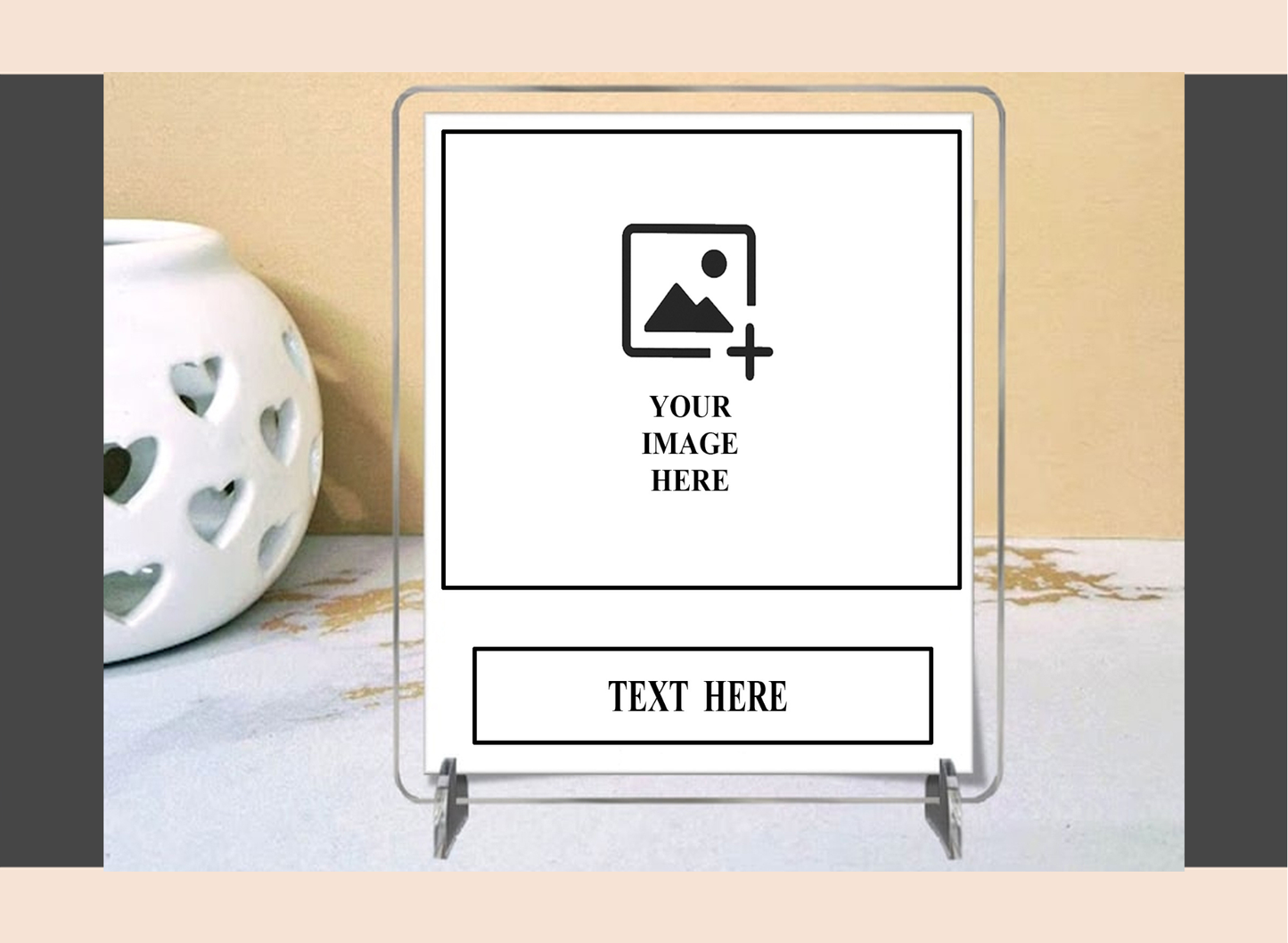 Clear acrylic polaroid frame with customizable text and image placeholders on a decorative surface.
