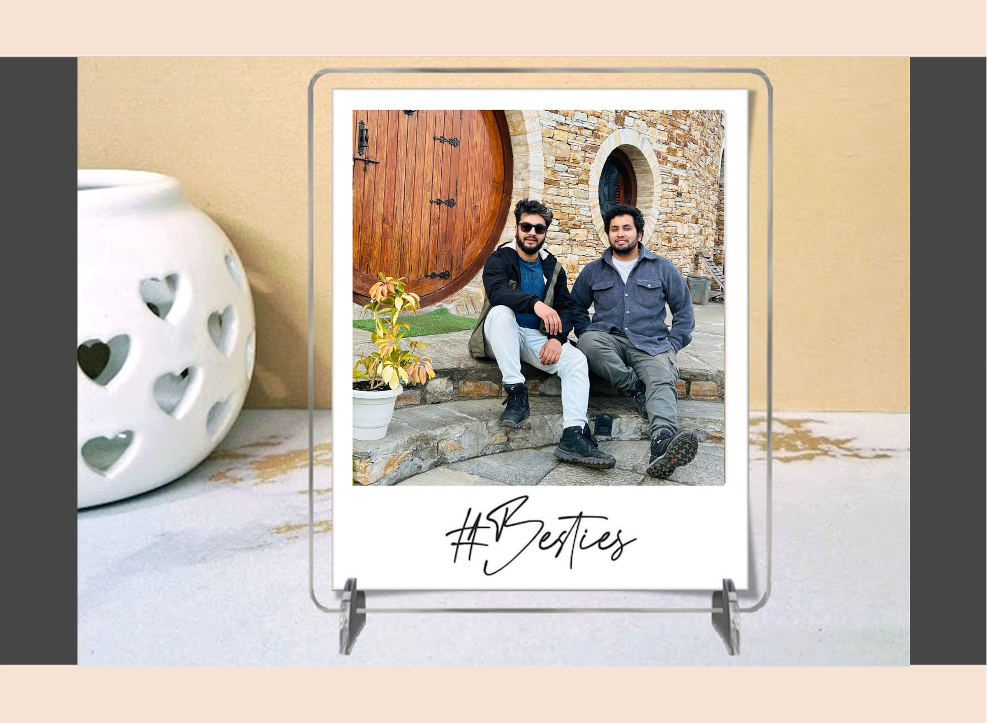 Acrylic polaroid frame with a picture of two people and '#Besties' text on a decorative surface.