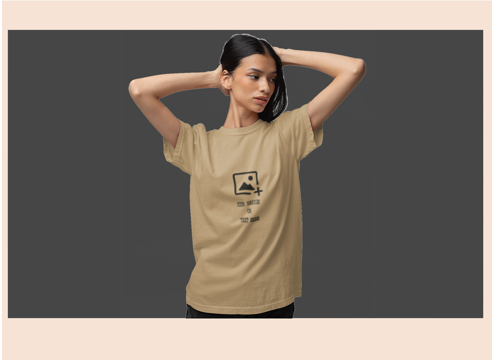 Woman wearing a beige t-shirt with a graphic design on a dark background