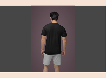 Person wearing a black t-shirt and gray shorts on a purple background