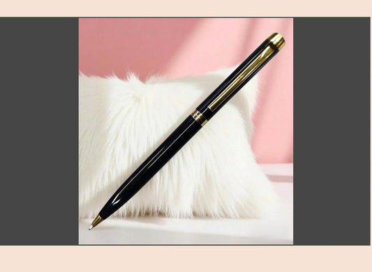 Pen on a white fur surface with a pink background