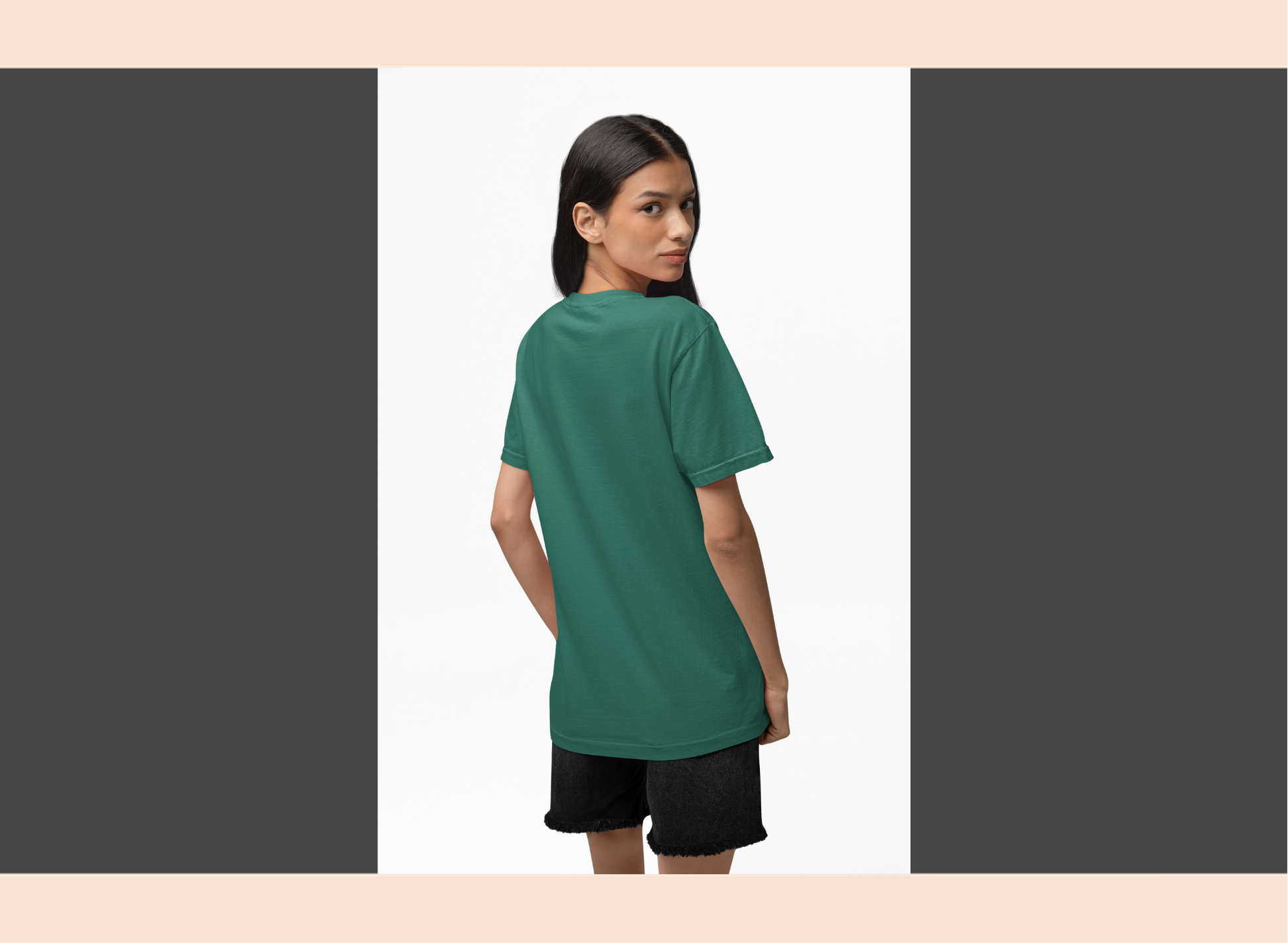 Woman wearing a green t-shirt and black shorts on a white background