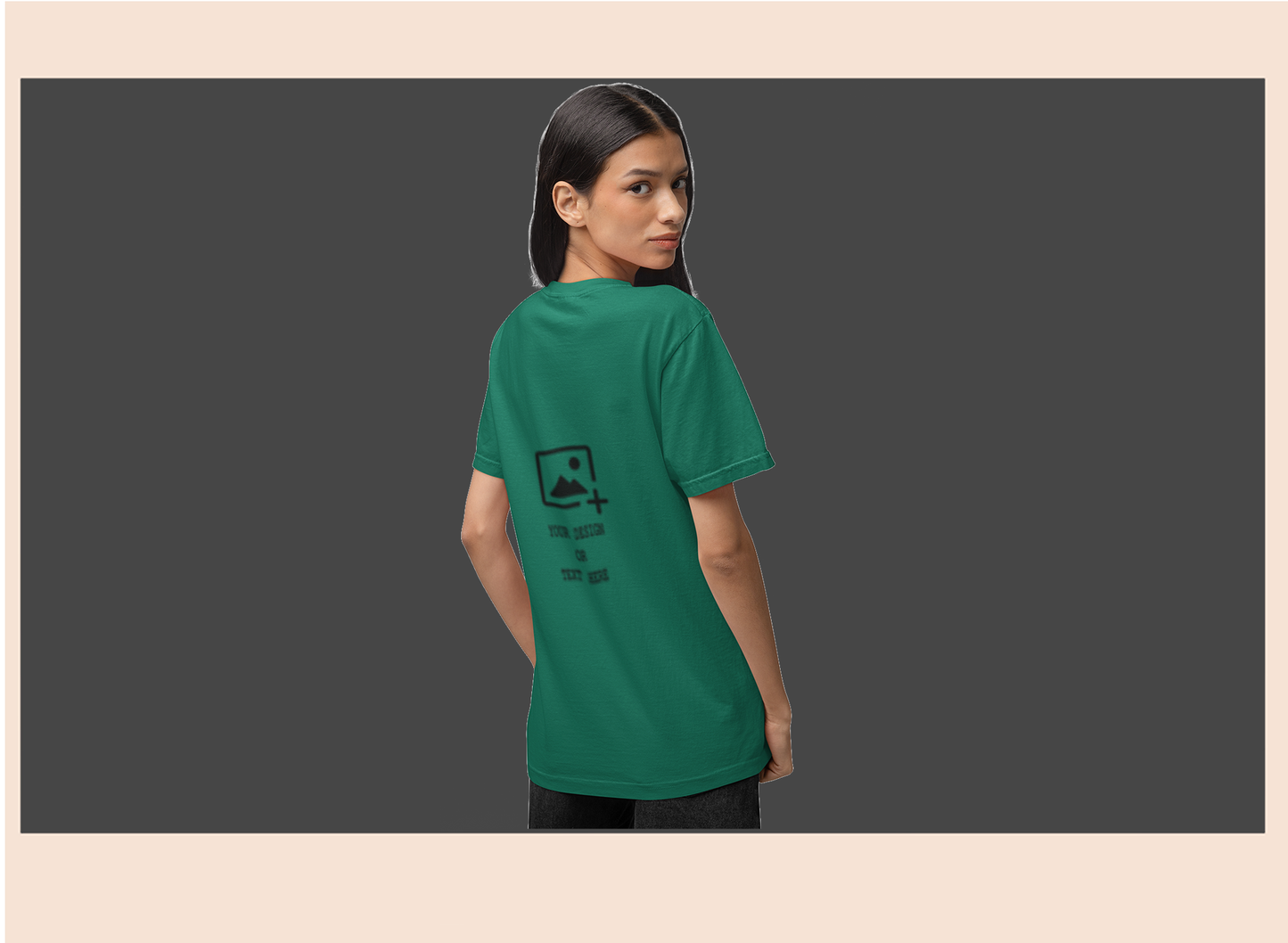 Person wearing a green t-shirt with a black graphic on a dark background