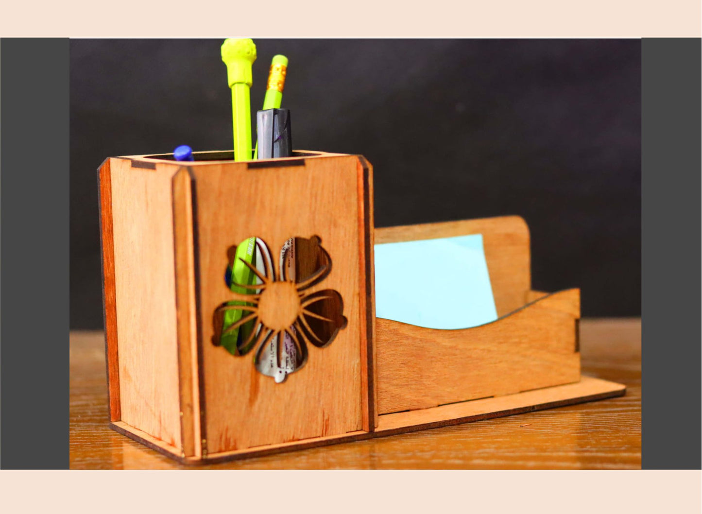 Wooden desk organizer with floral design on a dark background