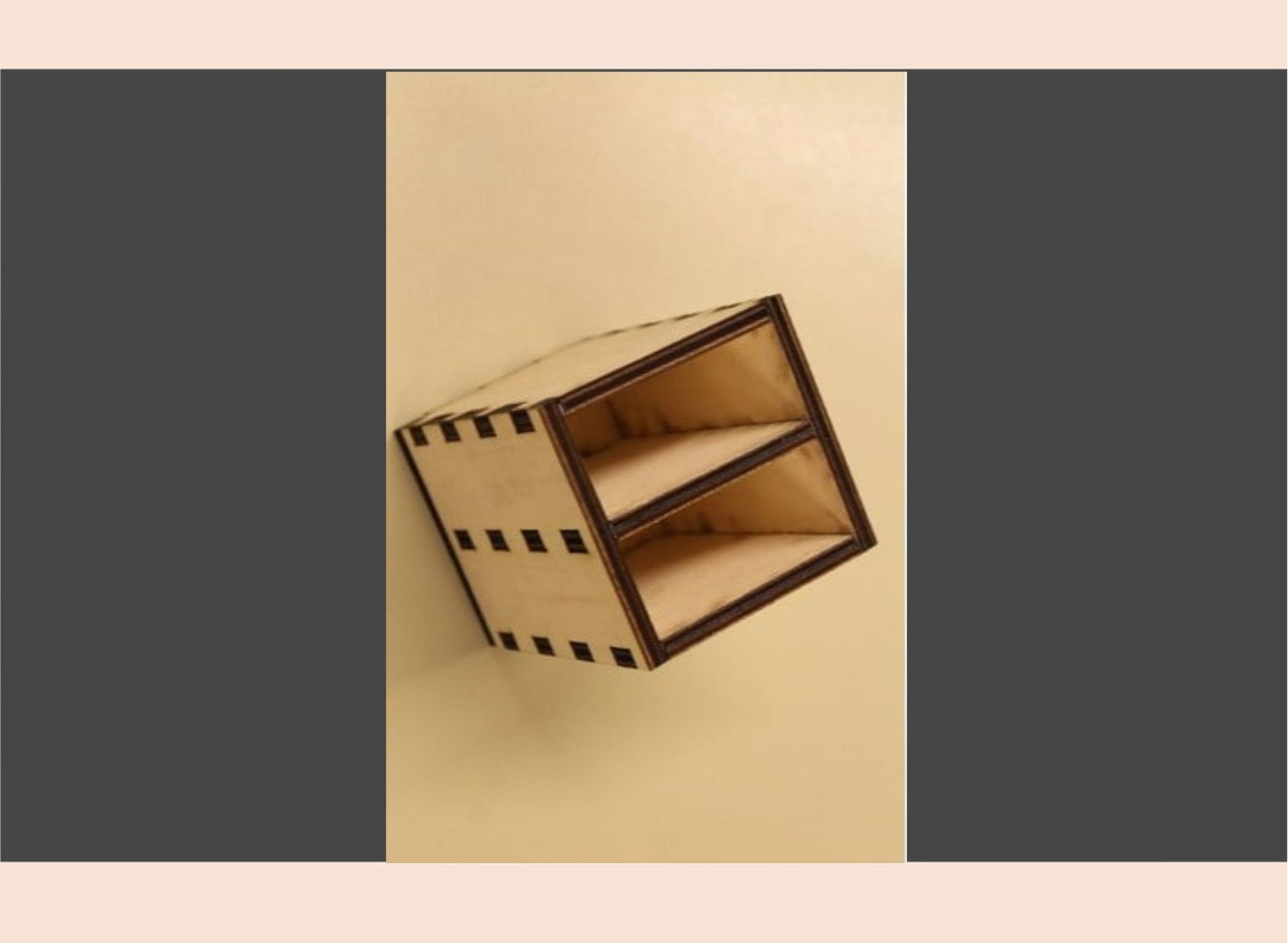 Wooden box with black stripes on a beige background