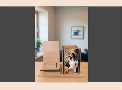 Wooden photo frame with a picture of a couple on a table in a room.