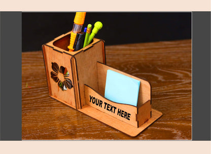 Wooden desk organizer with stationery items on a wooden surface