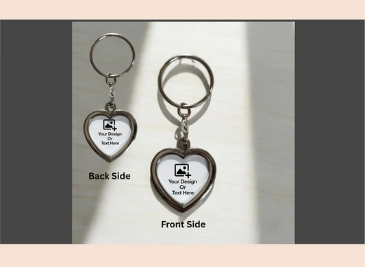 Heart-shaped keychain with front and back views on a neutral background