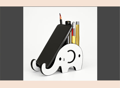 Elephant-shaped phone stand with phone and stationery on a white background
