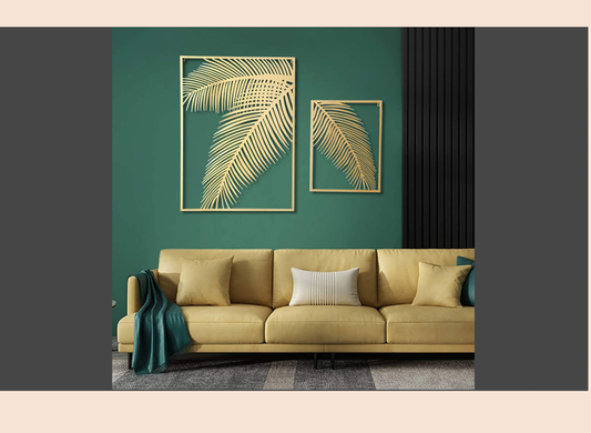 Beige sofa against a green wall with gold leaf art