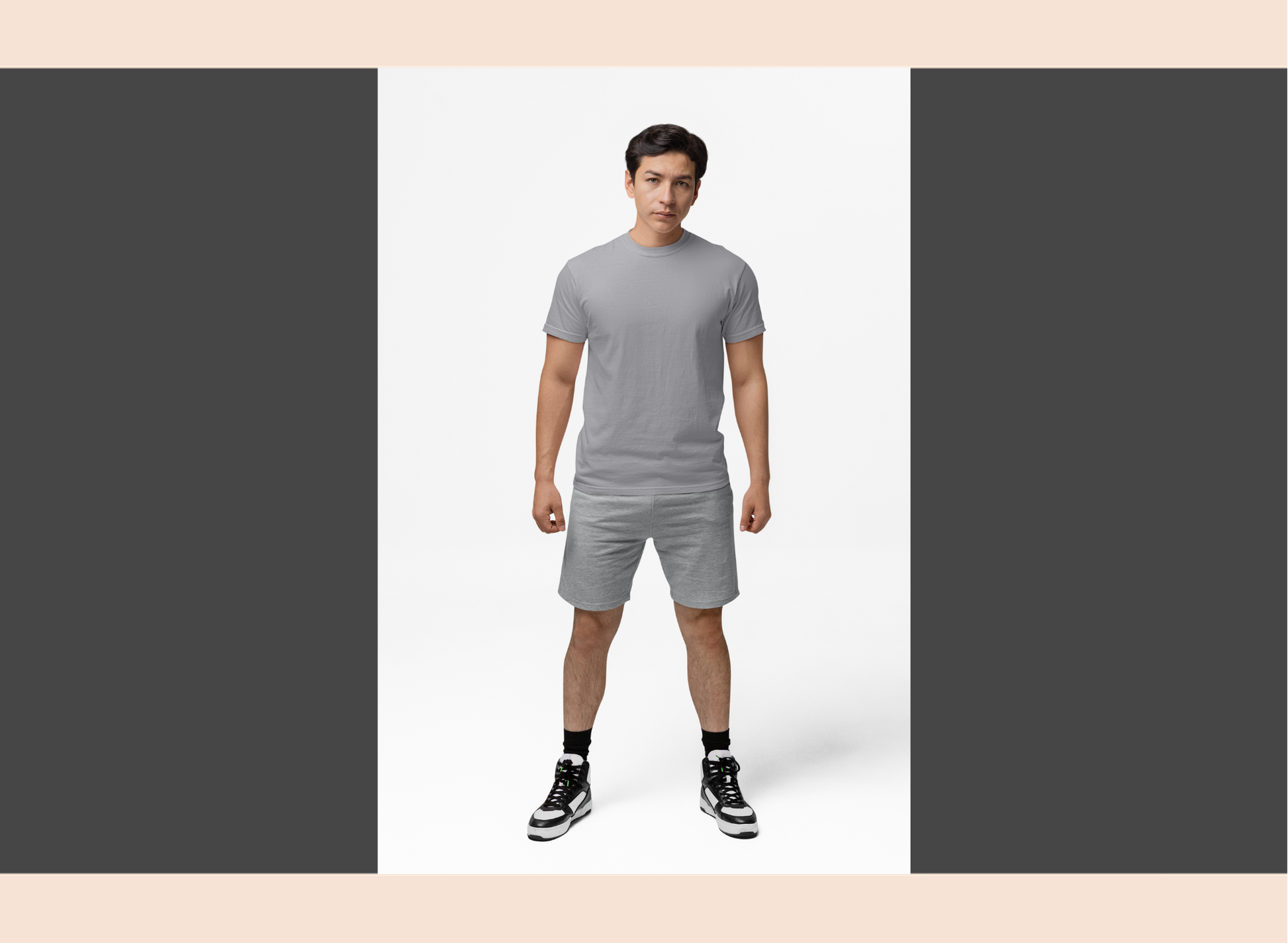 Man wearing a gray t-shirt and shorts set on a white background