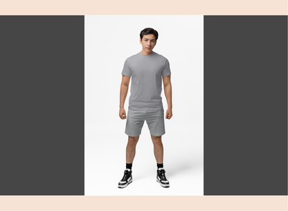 Man wearing a gray t-shirt and shorts set on a white background