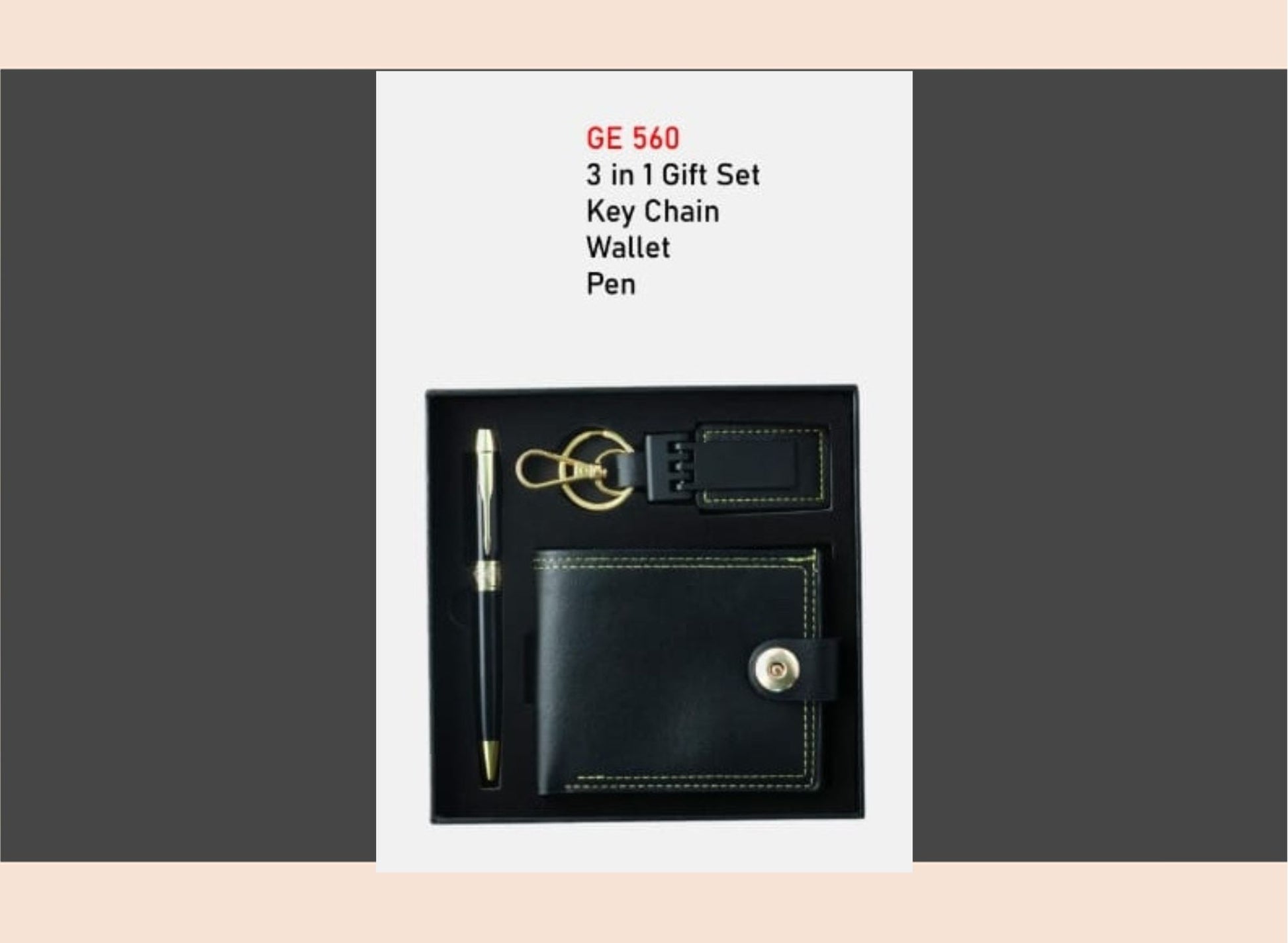 Black leather gift set with keychain, wallet, and pen on a gray background