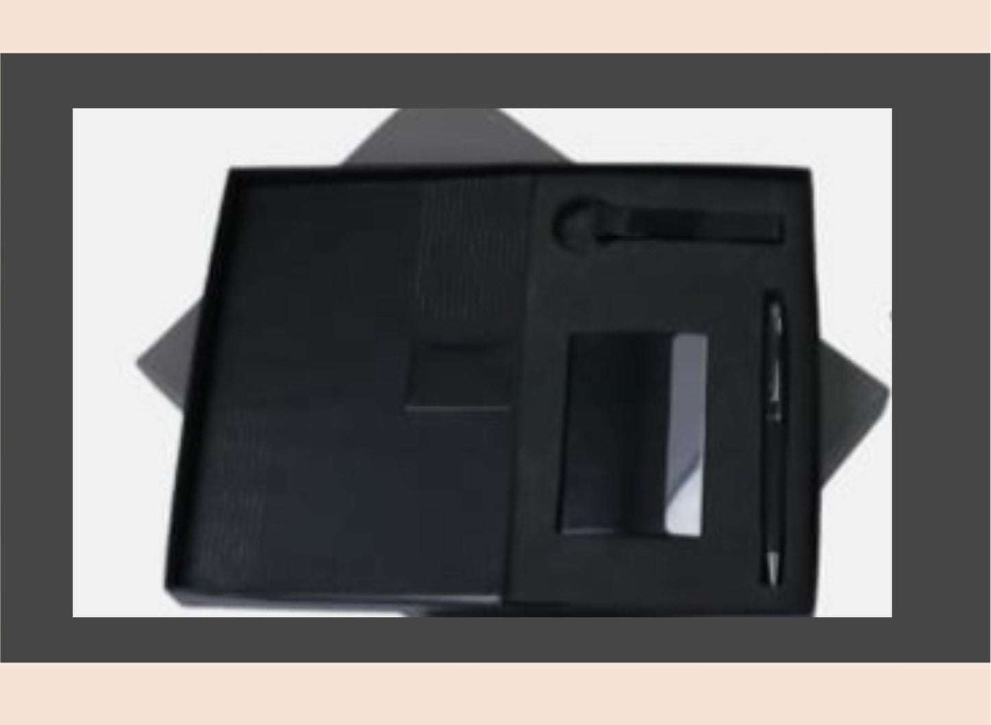 Black leather stationery set with pen, notebook, and other items on a white background