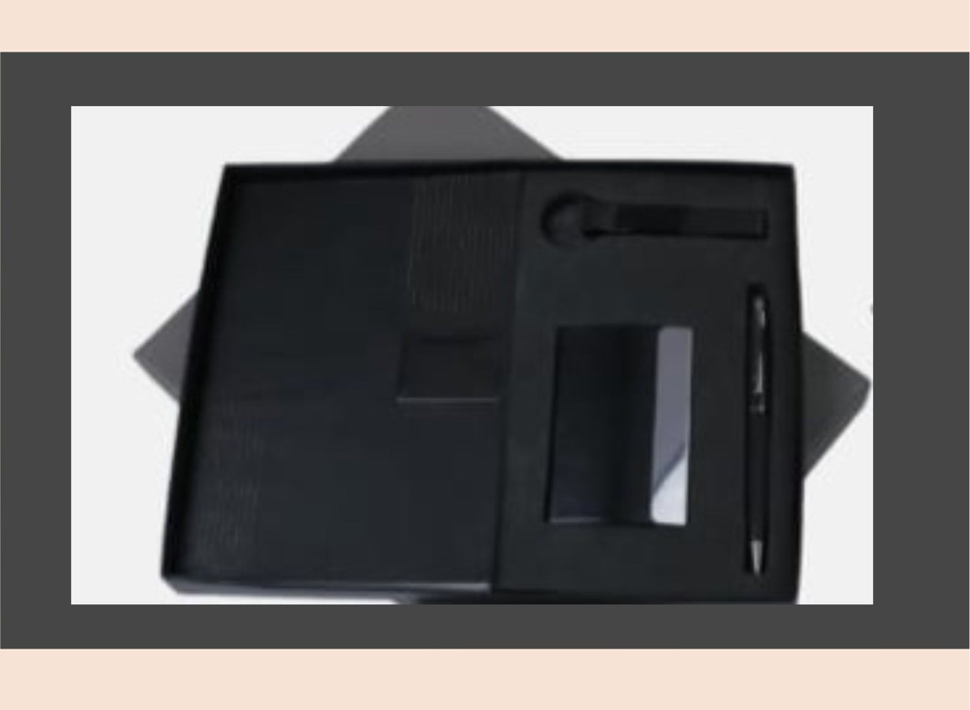 Black leather stationery set with pen, notebook, and other items on a white background