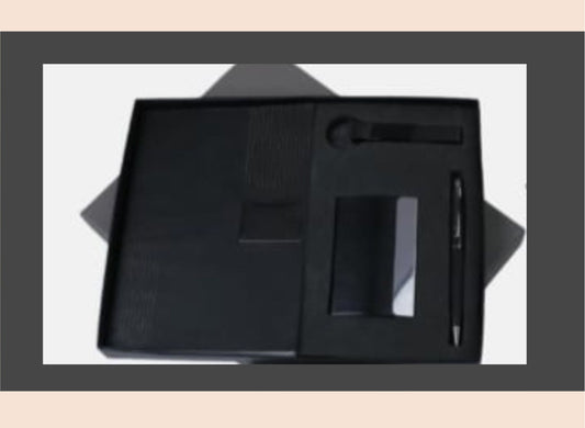 Black leather stationery set with pen, notebook, and other items on a white background