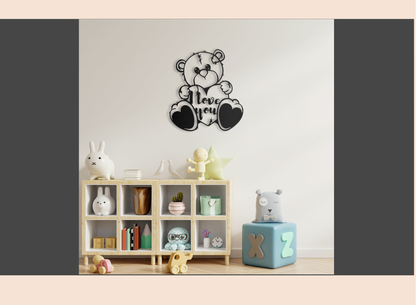 Decorative wall art of a teddy bear with 'I love you' text in a room with toys and books.