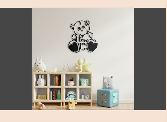 Decorative wall art of a teddy bear with 'I love you' text in a room with toys and books.