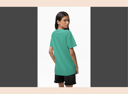 Woman wearing a teal t-shirt and black shorts on a white background