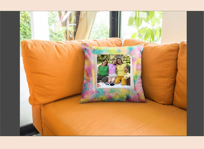 Colorful pillow with a family photo on an orange couch by a window.