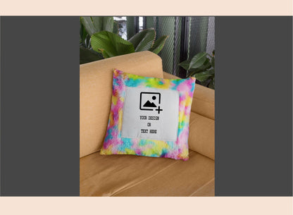 Colorful tie-dye pillow with a customizable design on a beige couch.