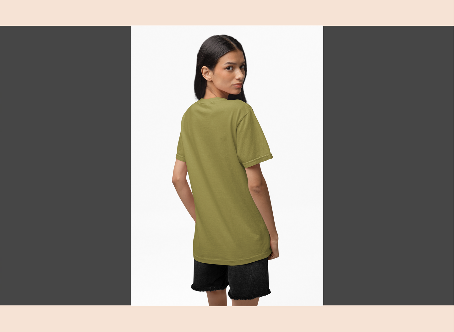Woman wearing a green t-shirt and black shorts on a white background
