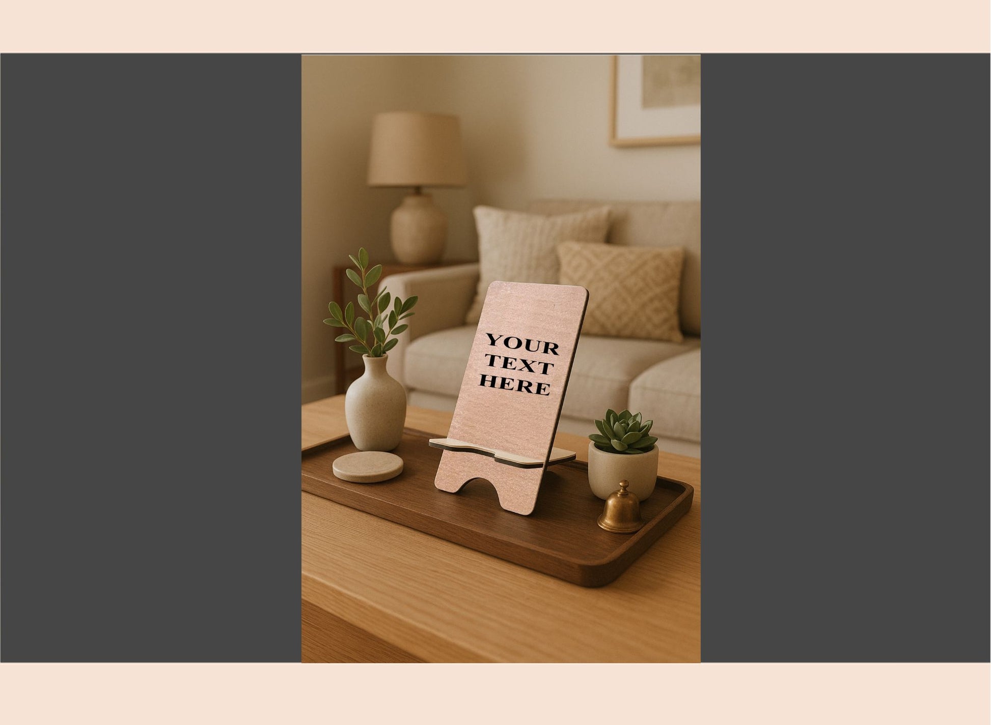 Decorative setting with a wooden tray, plant, and small easel on a table.