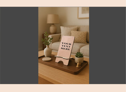 Decorative setting with a wooden tray, plant, and small easel on a table.