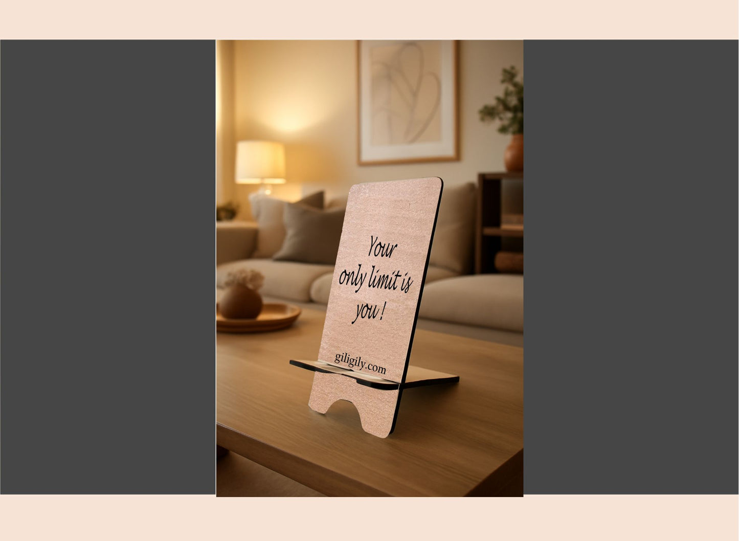 Motivational sign on a stand in a living room with a couch and lamp in the background.