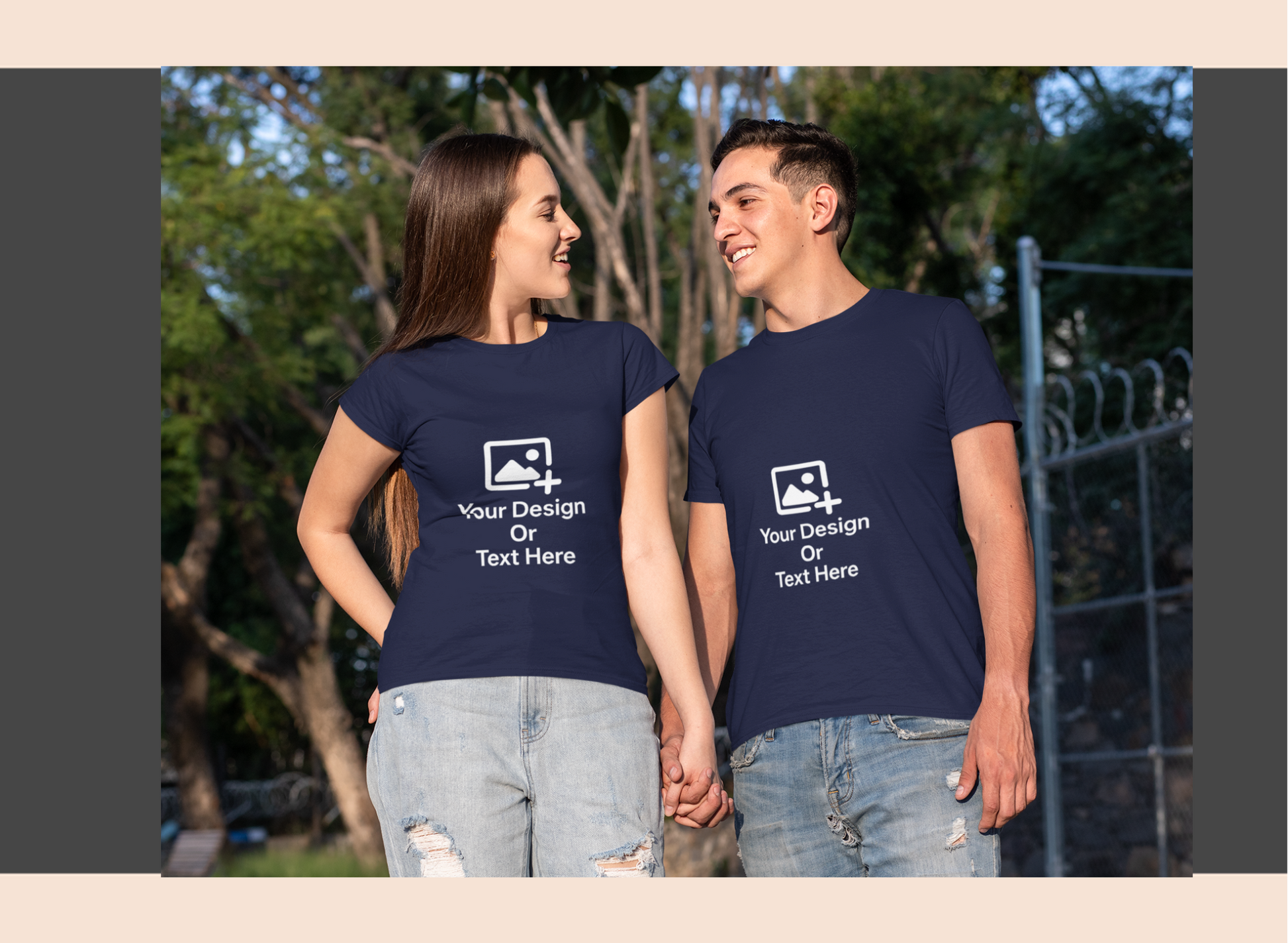 Two people wearing navy blue t-shirts with customizable design and text options outdoors.