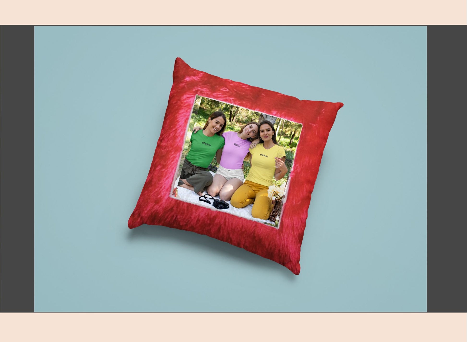Red pillow with a family photo on a light blue background