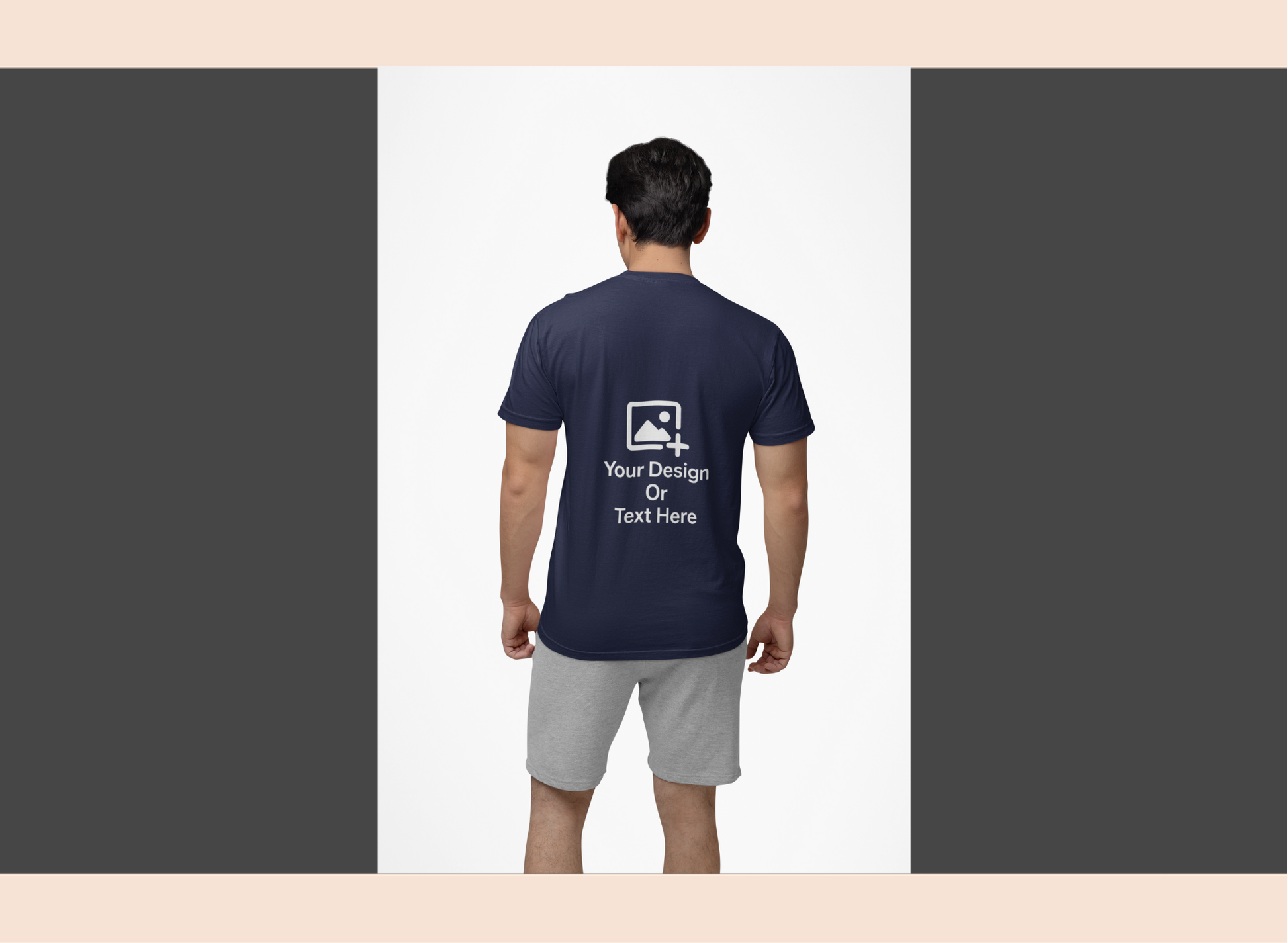 Person wearing a navy blue t-shirt with customizable text or design area on the back, standing against a white background.