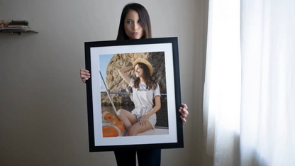 Framed family photo on a wall with decorative elements
