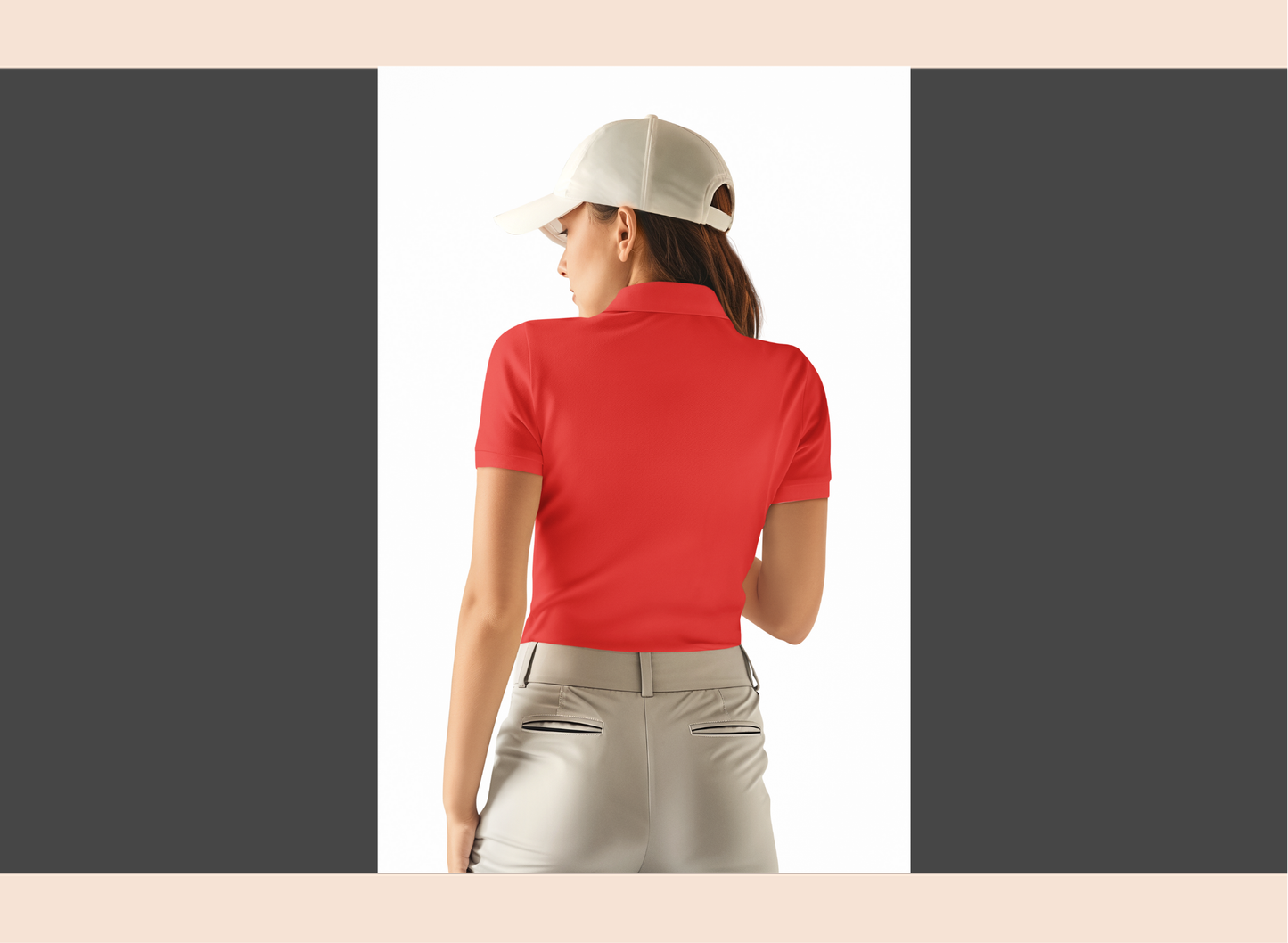 Woman in a red shirt and white pants standing on a golf course with a golf cart in the background.