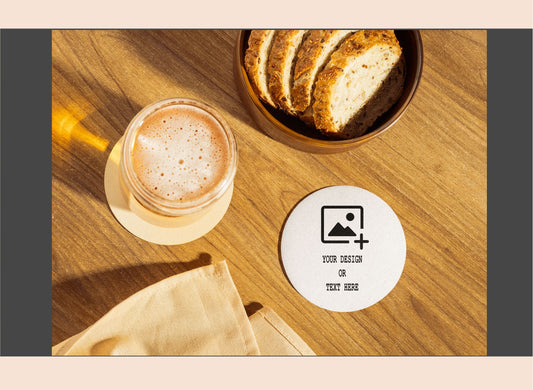 Glass of coffee and bread on a wooden table with a customizable coaster.