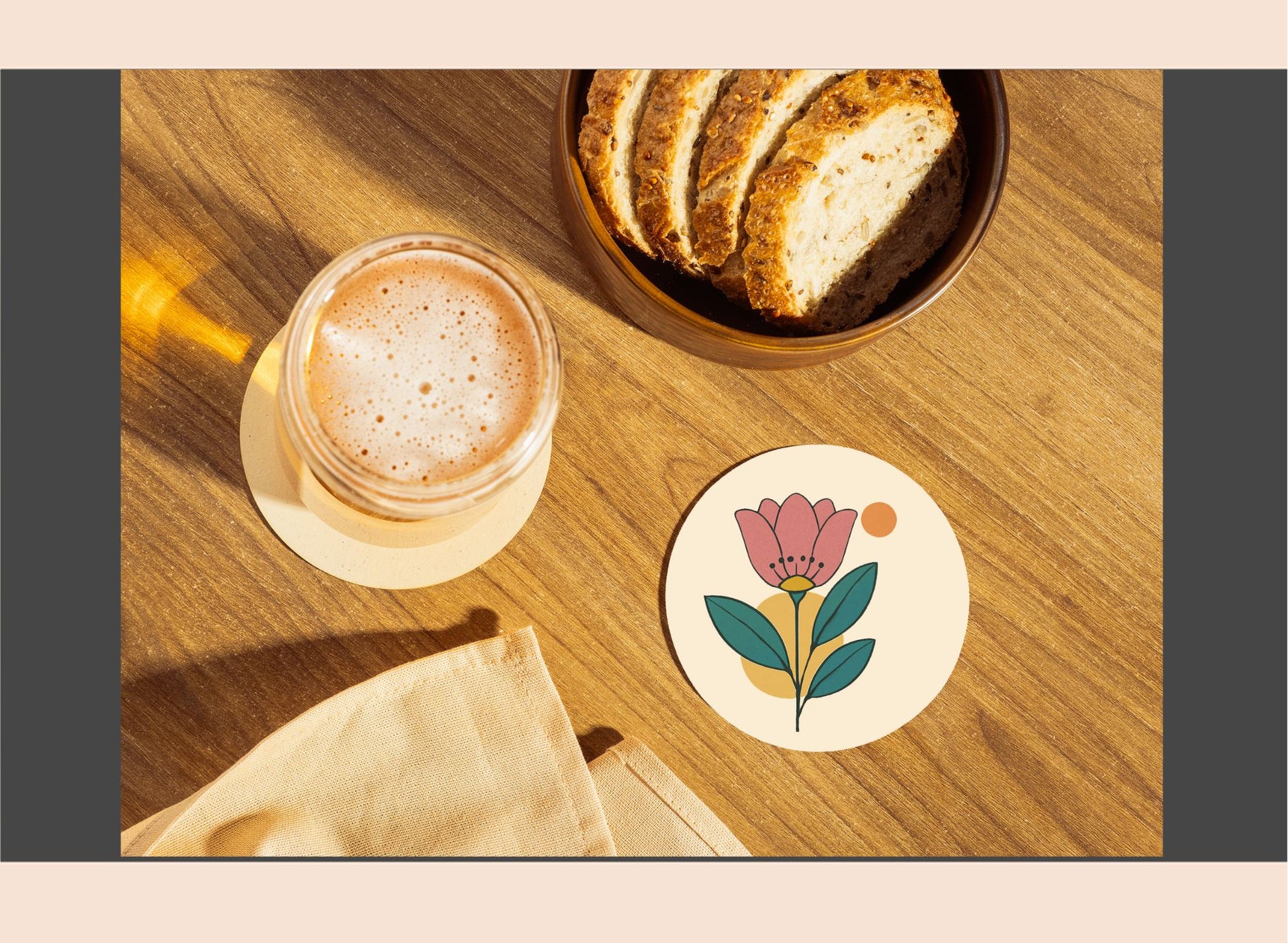 Cup of coffee with a floral coaster on a wooden table
