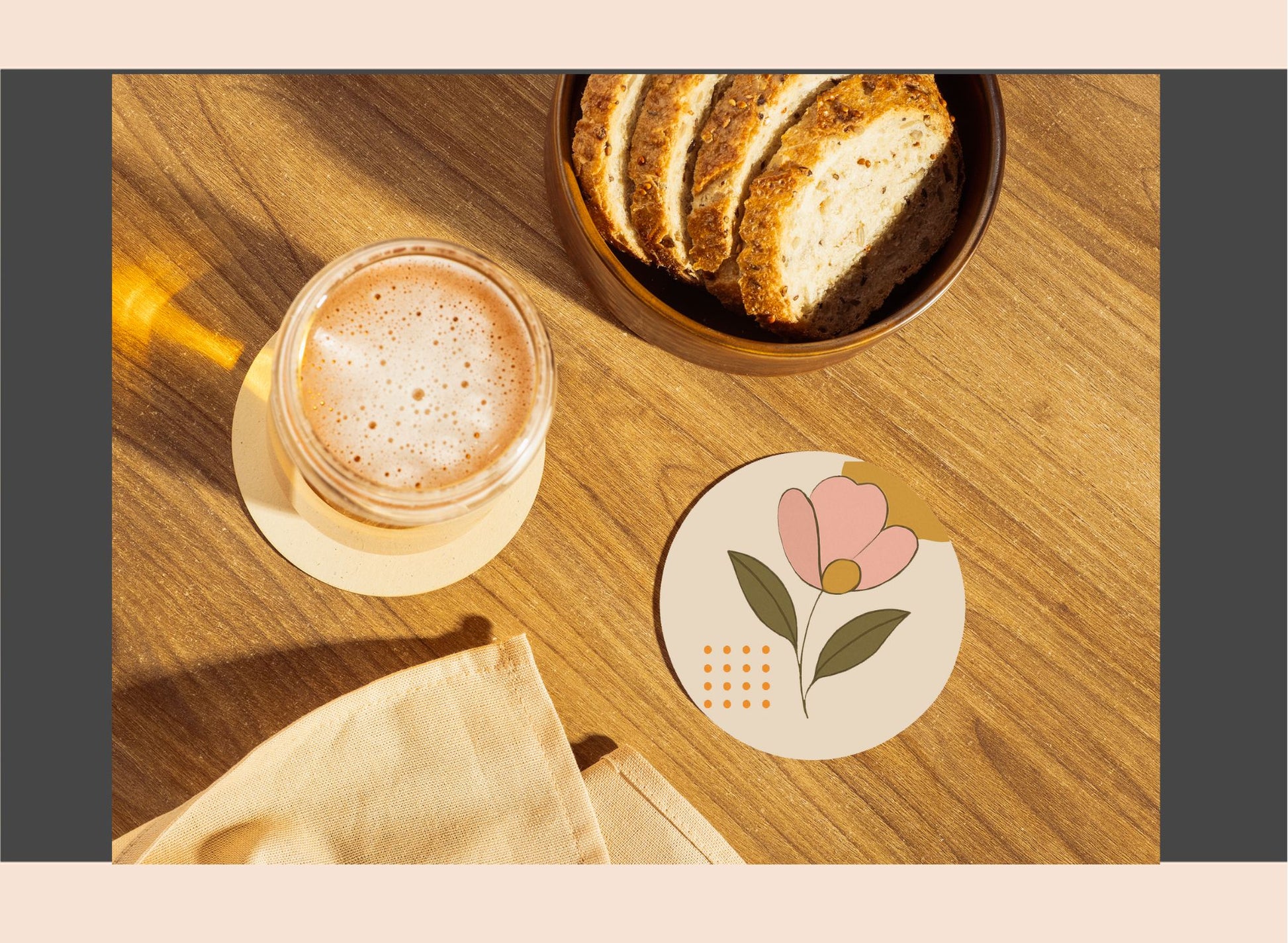 Cup of coffee with a flower coaster on a wooden table
