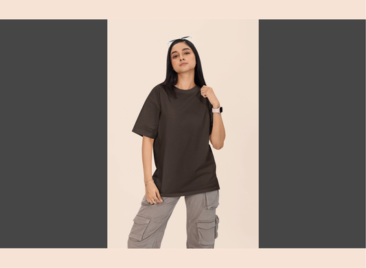 Person wearing a dark t-shirt and gray cargo pants on a beige background