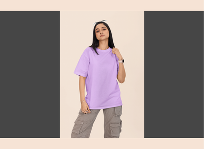 Person wearing a light purple t-shirt and gray cargo pants on a beige background
