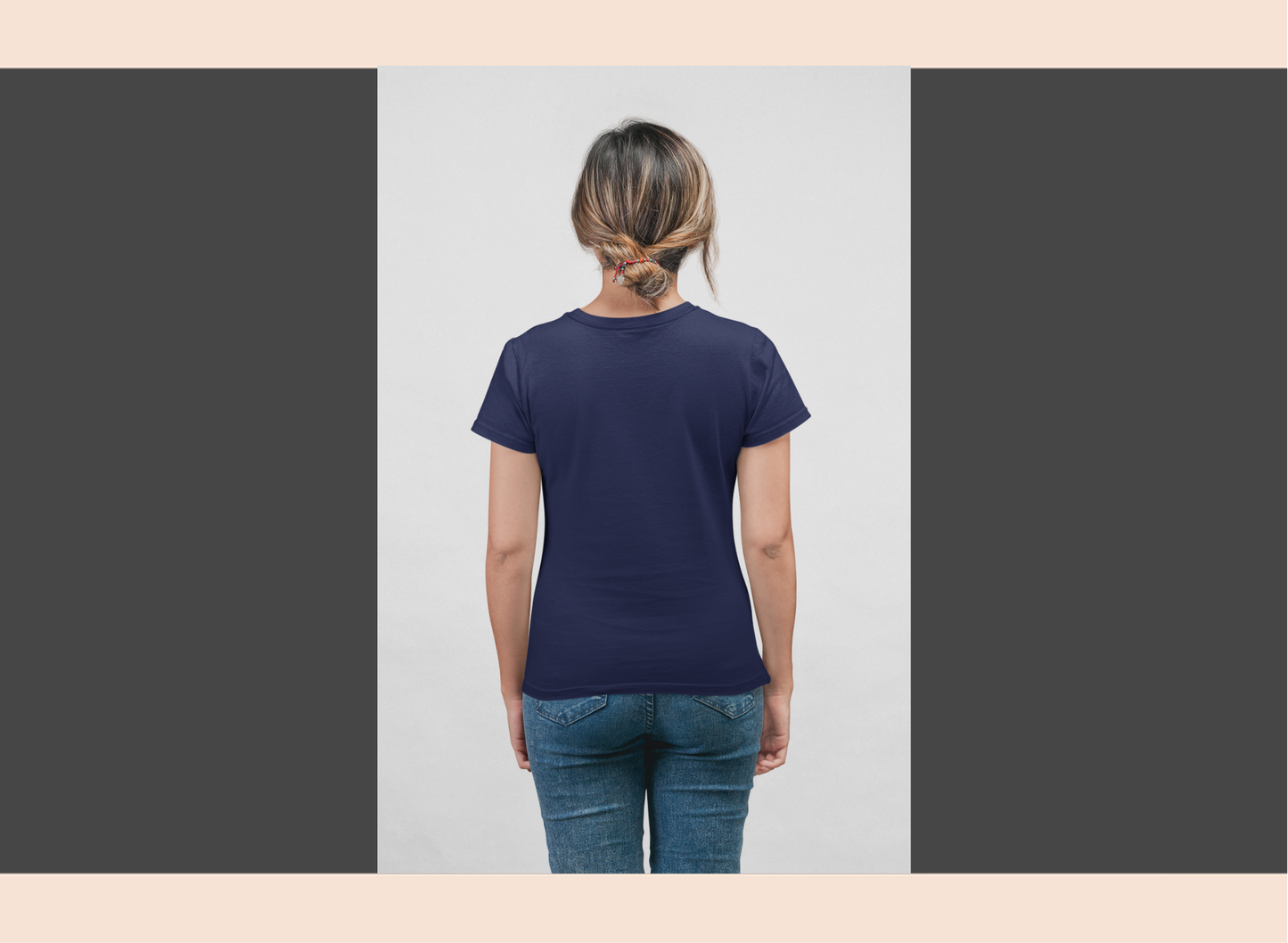 Person wearing a navy blue t-shirt on a plain background