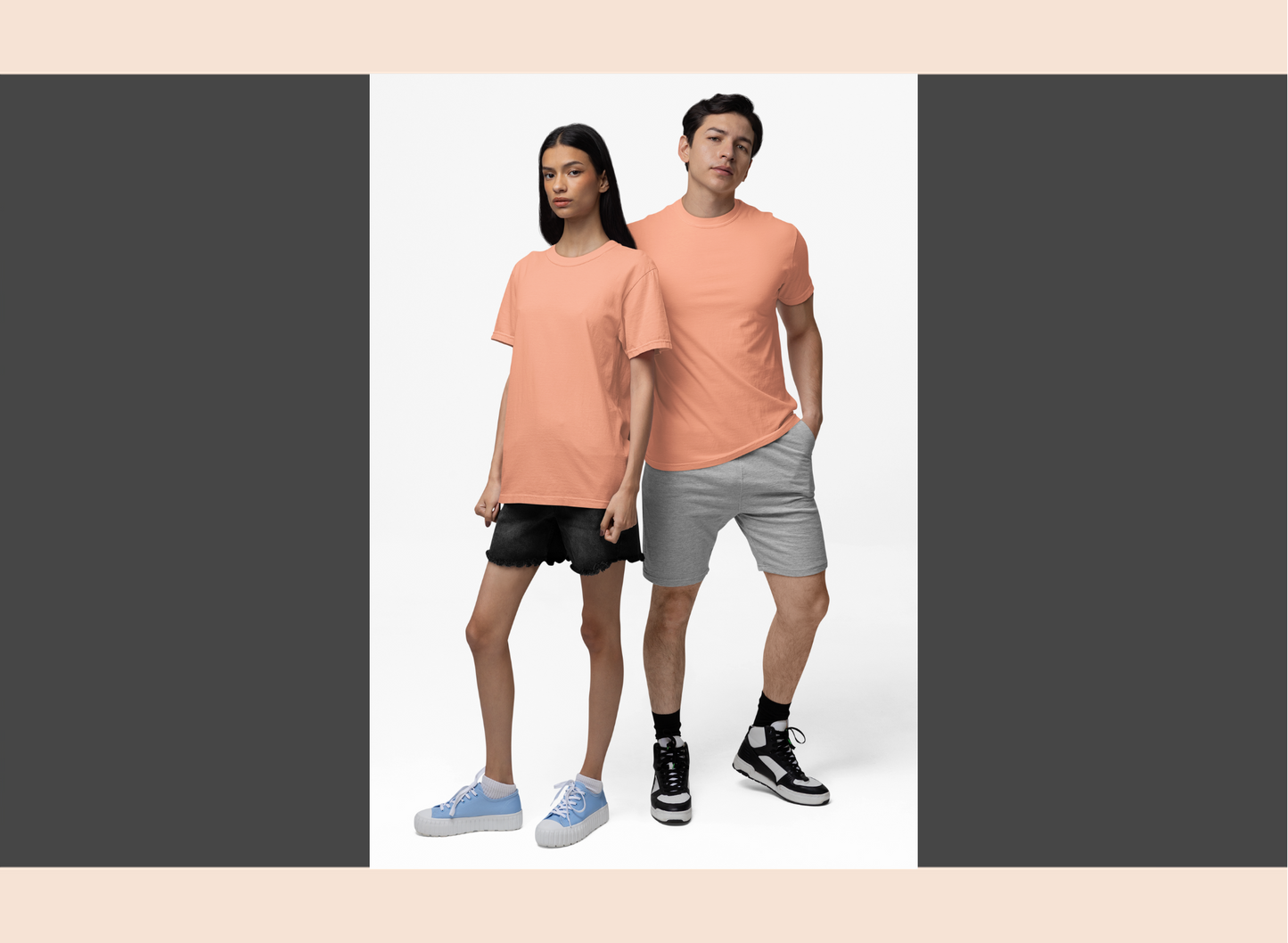 Two people wearing matching peach t-shirts on a white background