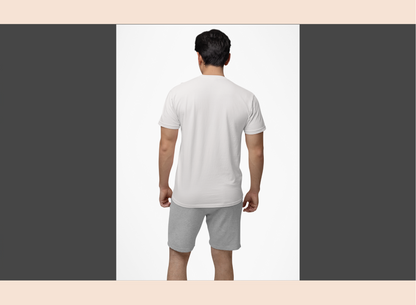 Man wearing a white t-shirt and gray shorts on a plain background