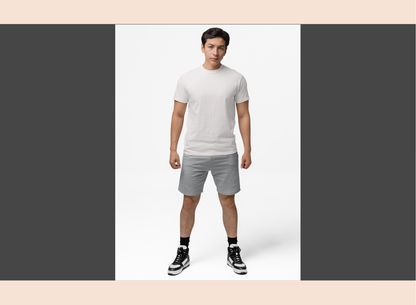 Man wearing a white t-shirt and gray shorts on a white background