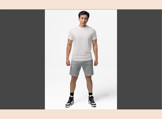 Man wearing a white t-shirt and gray shorts on a white background