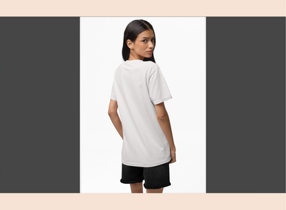Woman wearing a white t-shirt and black shorts on a plain background