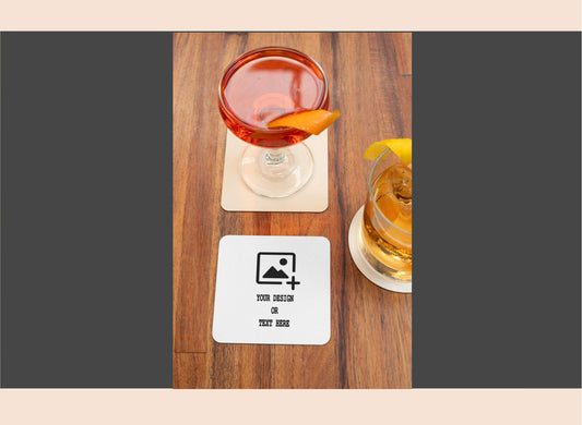 Two cocktails on wooden coasters with a customizable coaster design card.