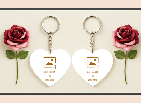 Heart-shaped keychains with customizable design area between two red roses on a light background