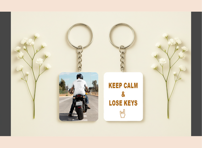 Two keychains on a light background with decorative elements