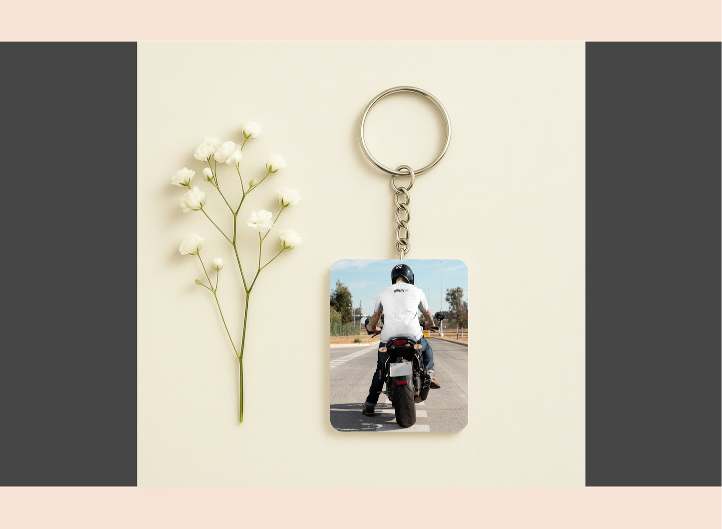 Keychain with photo of person on a motorcycle next to a small plant on a light background